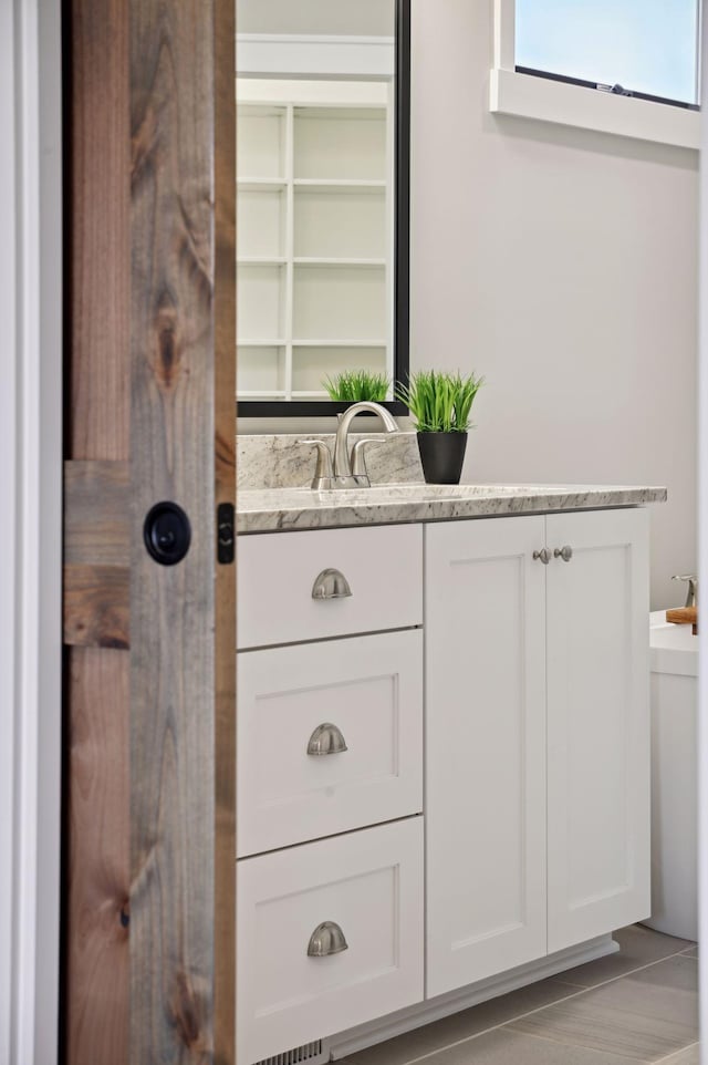 18022 Urbank St NE, Ham Lake, MN 55304 - bathroom with vanity and tile patterned flooring