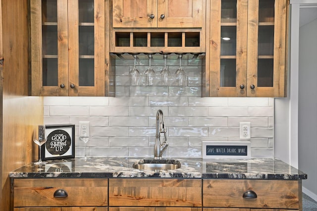 18022 Urbank St NE, Ham Lake, MN 55304 - kitchen with a sink, glass insert cabinets, brown cabinetry, and dark stone countertops