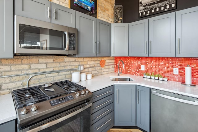901 3rd St Unit 411, Minneapolis, MN 55401 - kitchen with appliances with stainless steel finishes, a sink, and light countertops
