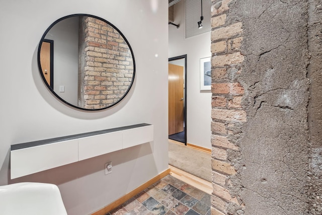 901 3rd St Unit 411, Minneapolis, MN 55401 - hallway featuring baseboards and stone finish floors