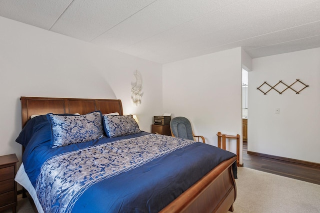 3300 Louisiana Ave S Unit 122, Saint Louis Park, MN 55426 - carpeted bedroom with baseboards and wood finished floors