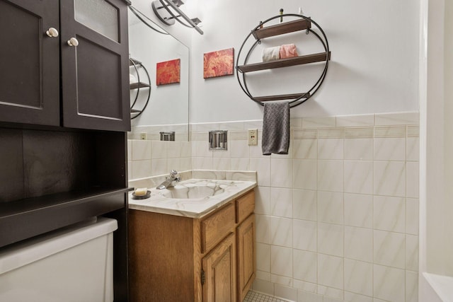 3300 Louisiana Ave S Unit 122, Saint Louis Park, MN 55426 - bathroom featuring toilet, vanity, and tile walls