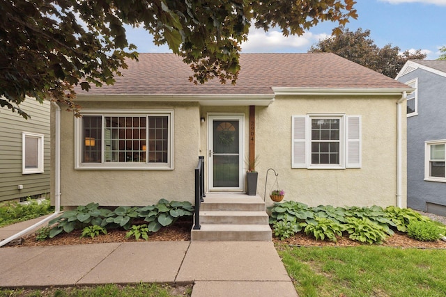 2904 Jersey Ave S, Saint Louis Park, MN 55426 - view of front of home with roof with shingles and stucco siding