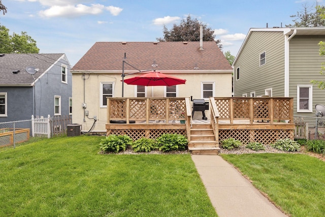 2904 Jersey Ave S, Saint Louis Park, MN 55426 - rear view of property featuring roof with shingles, stucco siding, and a wooden deck