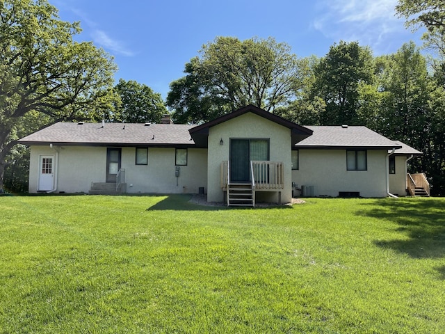 8048 Lake Ida Way NW, Alexandria, MN 56308 - back of house featuring stucco siding, a lawn, and central air condition unit