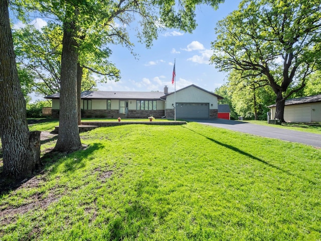 8048 Lake Ida Way NW, Alexandria, MN 56308 - ranch-style house with asphalt driveway, an attached garage, a front yard, and stone siding