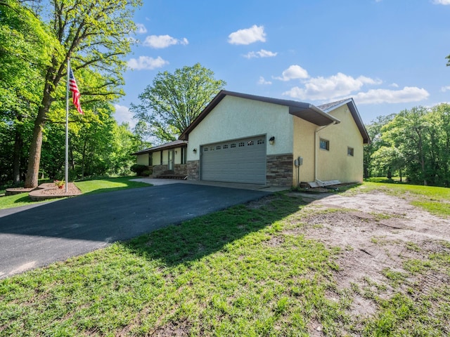 8048 Lake Ida Way NW, Alexandria, MN 56308 - view of front of home featuring stone siding, stucco siding, an attached garage, asphalt driveway, and a front lawn