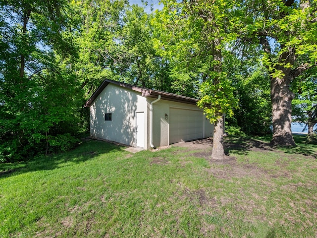 8048 Lake Ida Way NW, Alexandria, MN 56308 - view of grassy yard with an outdoor structure and a garage