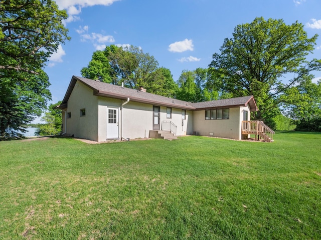 8048 Lake Ida Way NW, Alexandria, MN 56308 - rear view of property featuring stucco siding and a lawn
