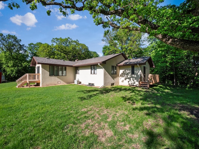 8048 Lake Ida Way NW, Alexandria, MN 56308 - back of house featuring stucco siding and a yard