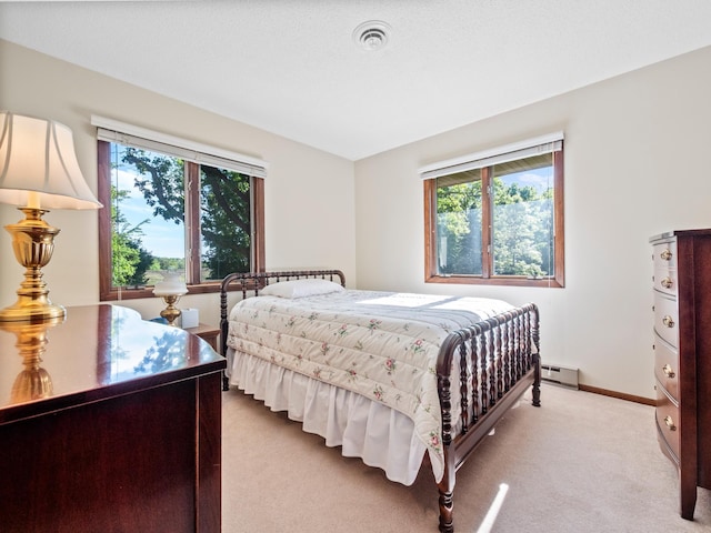 8048 Lake Ida Way NW, Alexandria, MN 56308 - bedroom with light colored carpet, multiple windows, a baseboard heating unit, and baseboards