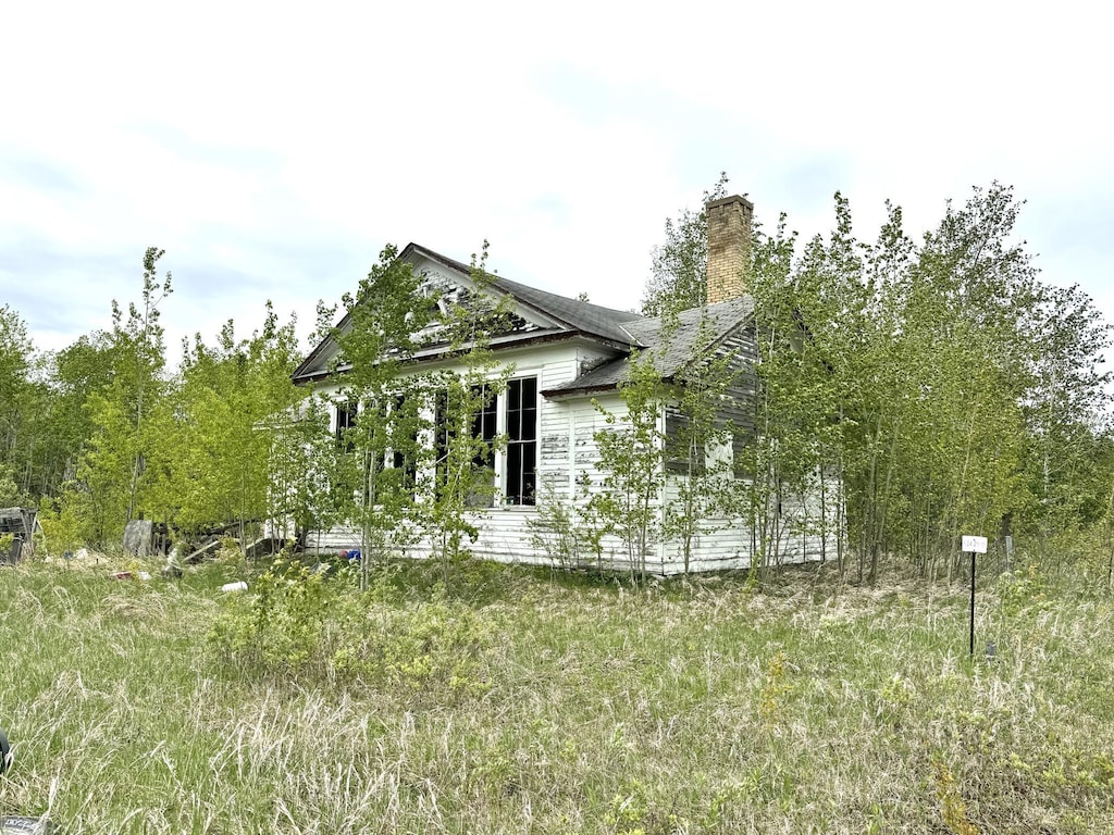 35346 240th St, Roseau, MN 56751 - view of property exterior with a chimney