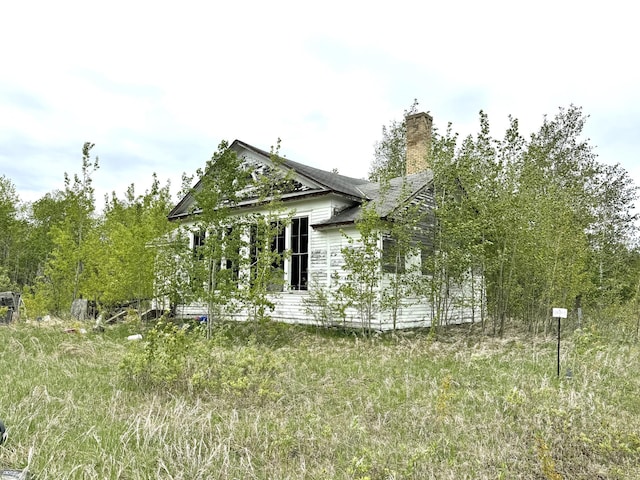 35346 240th St, Roseau, MN 56751 - view of property exterior with a chimney