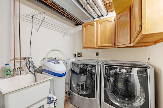 7719 Nicholas Way, Chanhassen, MN 55317 - laundry area with cabinet space, washing machine and dryer, and wood finished floors