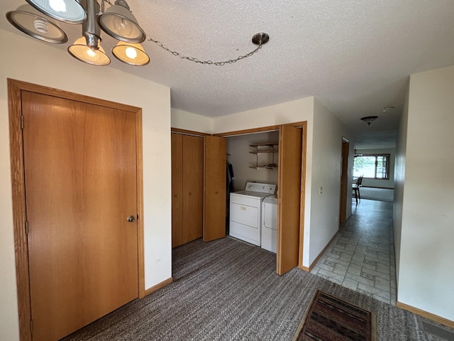 23759 Clarissa Haven Dr, Girard Twp, MN 56551 - laundry room featuring carpet flooring, washer and clothes dryer, a textured ceiling, and baseboards