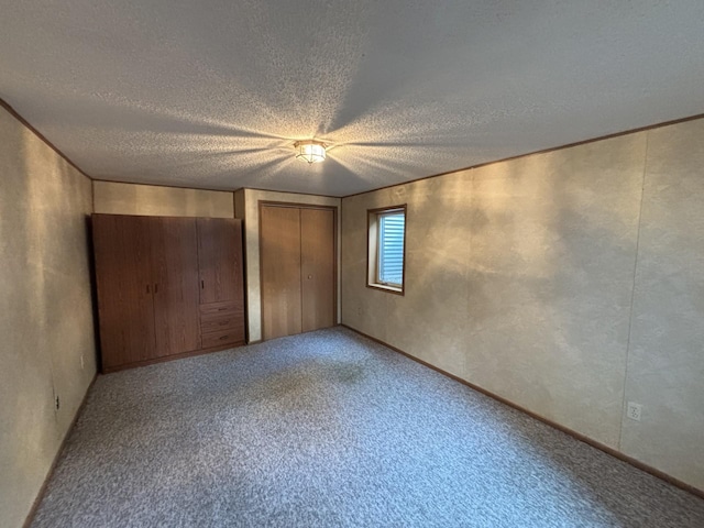 23759 Clarissa Haven Dr, Girard Twp, MN 56551 - unfurnished bedroom featuring a textured ceiling and carpet