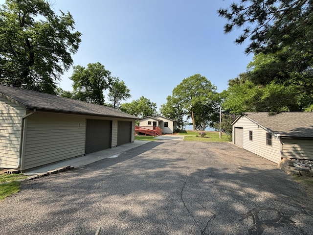 23759 Clarissa Haven Dr, Girard Twp, MN 56551 - view of side of home with an outbuilding and a detached garage