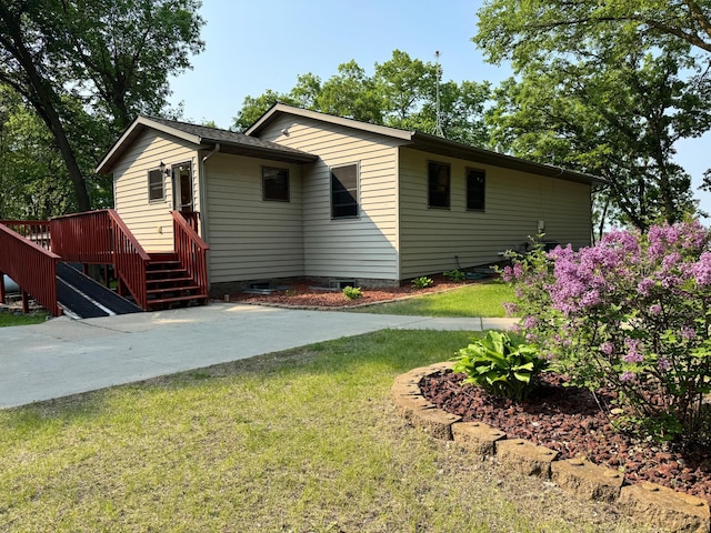 23759 Clarissa Haven Dr, Girard Twp, MN 56551 - view of front of house with a front yard and a patio area