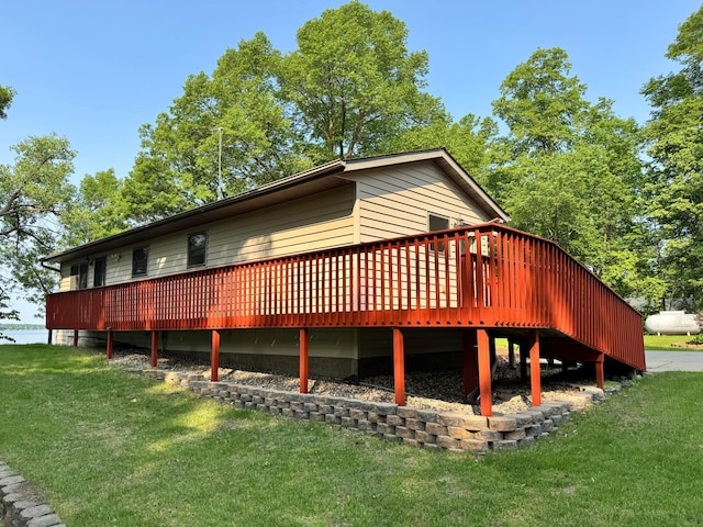 23759 Clarissa Haven Dr, Girard Twp, MN 56551 - back of property featuring a lawn and a wooden deck