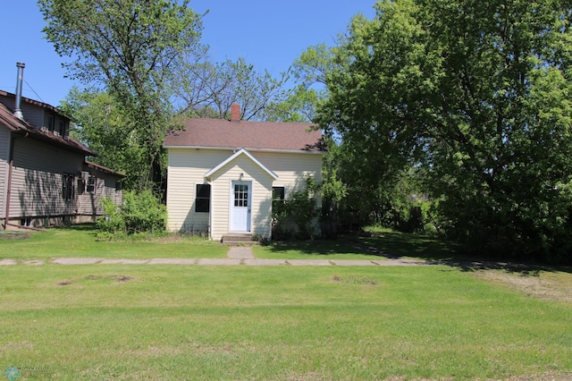 133 Welch St, Perley, MN 56574 - view of front facade featuring a front lawn and a chimney