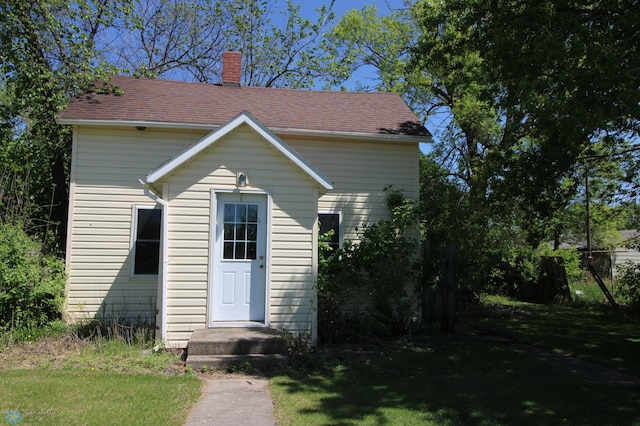 133 Welch St, Perley, MN 56574 - view of front of home featuring a chimney and a front yard