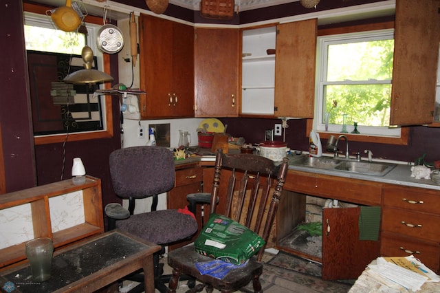 133 Welch St, Perley, MN 56574 - kitchen featuring brown cabinetry, plenty of natural light, and a sink
