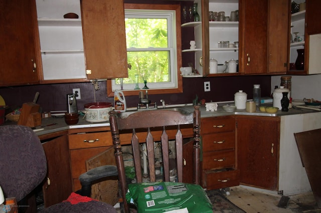 133 Welch St, Perley, MN 56574 - kitchen with brown cabinetry, light countertops, and open shelves