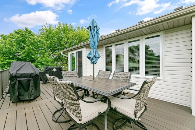 1600 Buffalo Cv, Buffalo, MN 55313 - wooden deck featuring outdoor dining space and a grill