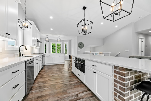 1600 Buffalo Cv, Buffalo, MN 55313 - kitchen featuring a sink, appliances with stainless steel finishes, recessed lighting, dark wood finished floors, and white cabinetry