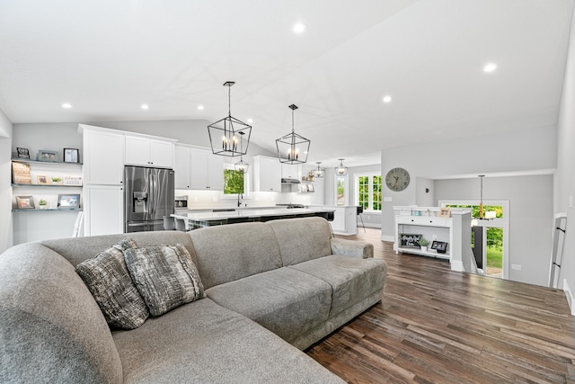 1600 Buffalo Cv, Buffalo, MN 55313 - living area with dark wood-style floors, vaulted ceiling, recessed lighting, and a chandelier