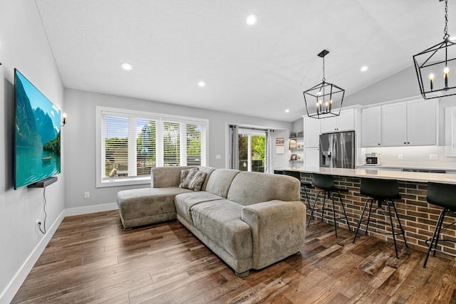 1600 Buffalo Cv, Buffalo, MN 55313 - living room with a chandelier, dark wood finished floors, baseboards, recessed lighting, and vaulted ceiling