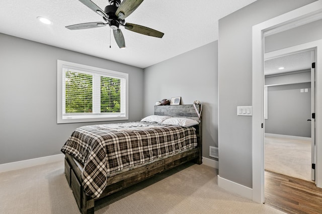 1600 Buffalo Cv, Buffalo, MN 55313 - bedroom with carpet flooring, baseboards, a textured ceiling, ceiling fan, and recessed lighting