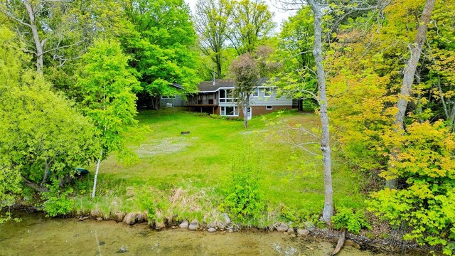 1331 9th St, Grand Rapids, MN 55744 - view of grassy yard with a deck