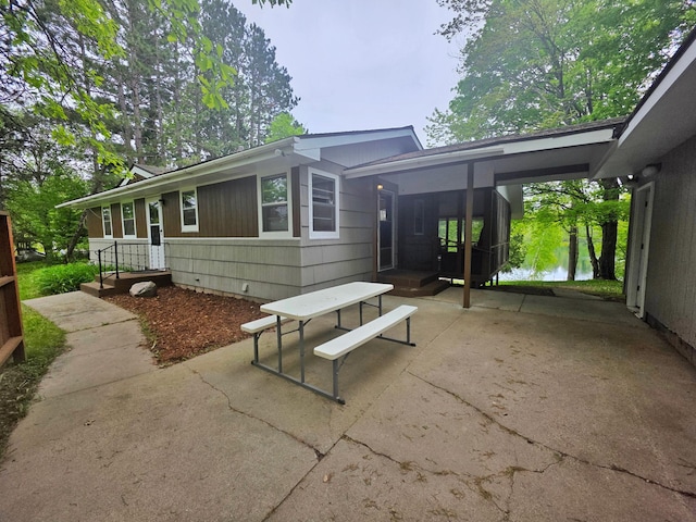 1331 9th St, Grand Rapids, MN 55744 - back of house featuring a patio
