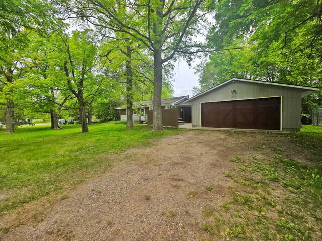 1331 9th St, Grand Rapids, MN 55744 - view of front of house with driveway and a front lawn