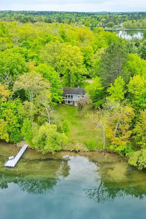 1331 9th St, Grand Rapids, MN 55744 - view from above of property featuring a forest and a nearby body of water