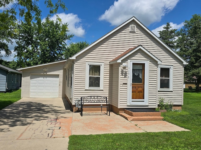 1156 River Rd, Windom, MN 56101 - view of front of property featuring driveway, a garage, a front lawn, and entry steps