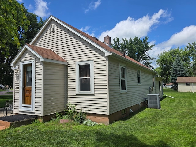 1156 River Rd, Windom, MN 56101 - view of side of home featuring a yard and a chimney