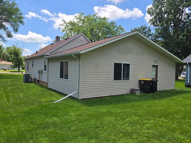 1156 River Rd, Windom, MN 56101 - view of side of property featuring a lawn and a chimney