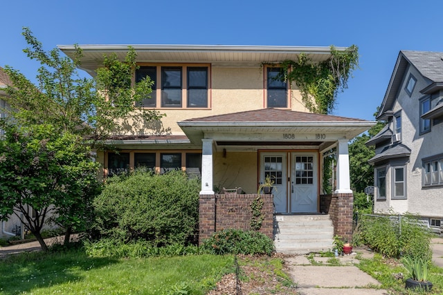 1808 Taylor St NE, Minneapolis, MN 55418 - view of front facade with a porch and stucco siding