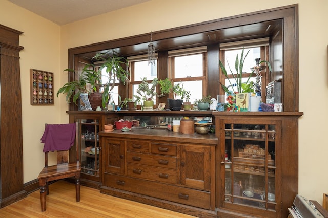 1808 Taylor St NE, Minneapolis, MN 55418 - bar area featuring wood finished floors and baseboards