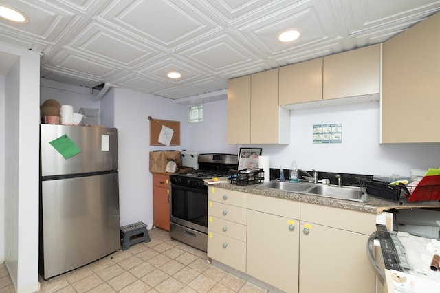 1808 Taylor St NE, Minneapolis, MN 55418 - kitchen featuring appliances with stainless steel finishes, cream cabinets, an ornate ceiling, and recessed lighting