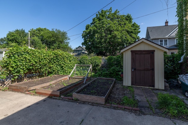 1808 Taylor St NE, Minneapolis, MN 55418 - view of yard featuring a garden and a storage shed