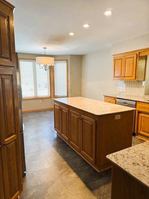9693 Falcons Way, Eden Prairie, MN 55347 - kitchen featuring a kitchen island, recessed lighting, tasteful backsplash, baseboards, and a chandelier