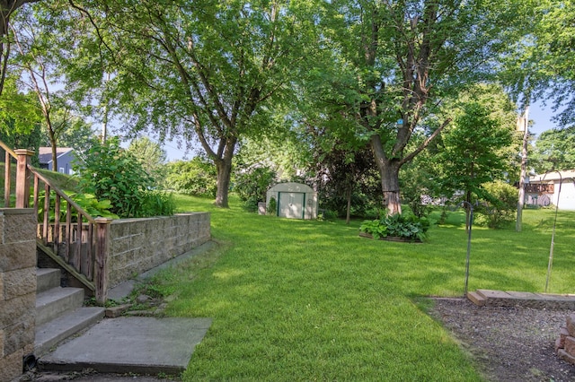 601 4th Ave N, Sauk Rapids, MN 56379 - view of grassy yard featuring a storage shed