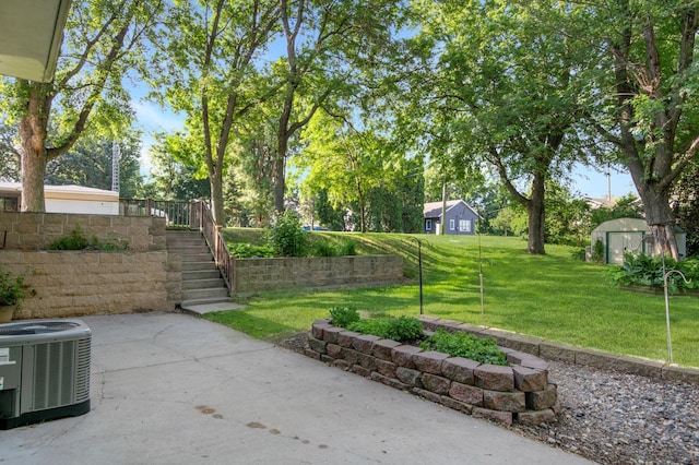 601 4th Ave N, Sauk Rapids, MN 56379 - view of green lawn featuring a patio area, a storage shed, and stairway