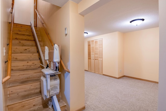 601 4th Ave N, Sauk Rapids, MN 56379 - stairway with a textured ceiling and carpet floors
