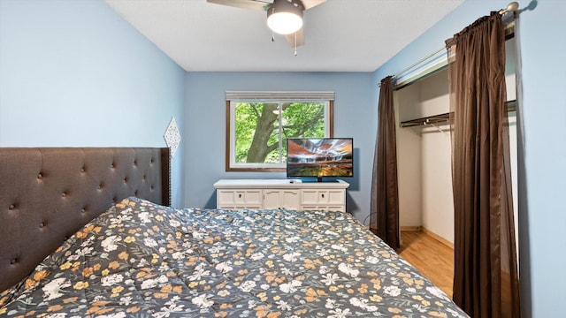 1504 89th Ave N, Brooklyn Park, MN 55444 - bedroom featuring light wood-style flooring, ceiling fan, and a closet