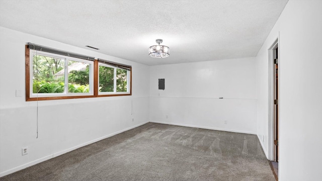 1504 89th Ave N, Brooklyn Park, MN 55444 - carpeted spare room with a textured ceiling, a chandelier, and baseboards