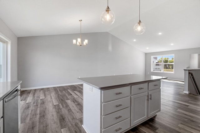 1020 2nd St NW, Delano, MN 55328 - kitchen featuring open floor plan, dark wood-style flooring, vaulted ceiling, a center island, and a chandelier